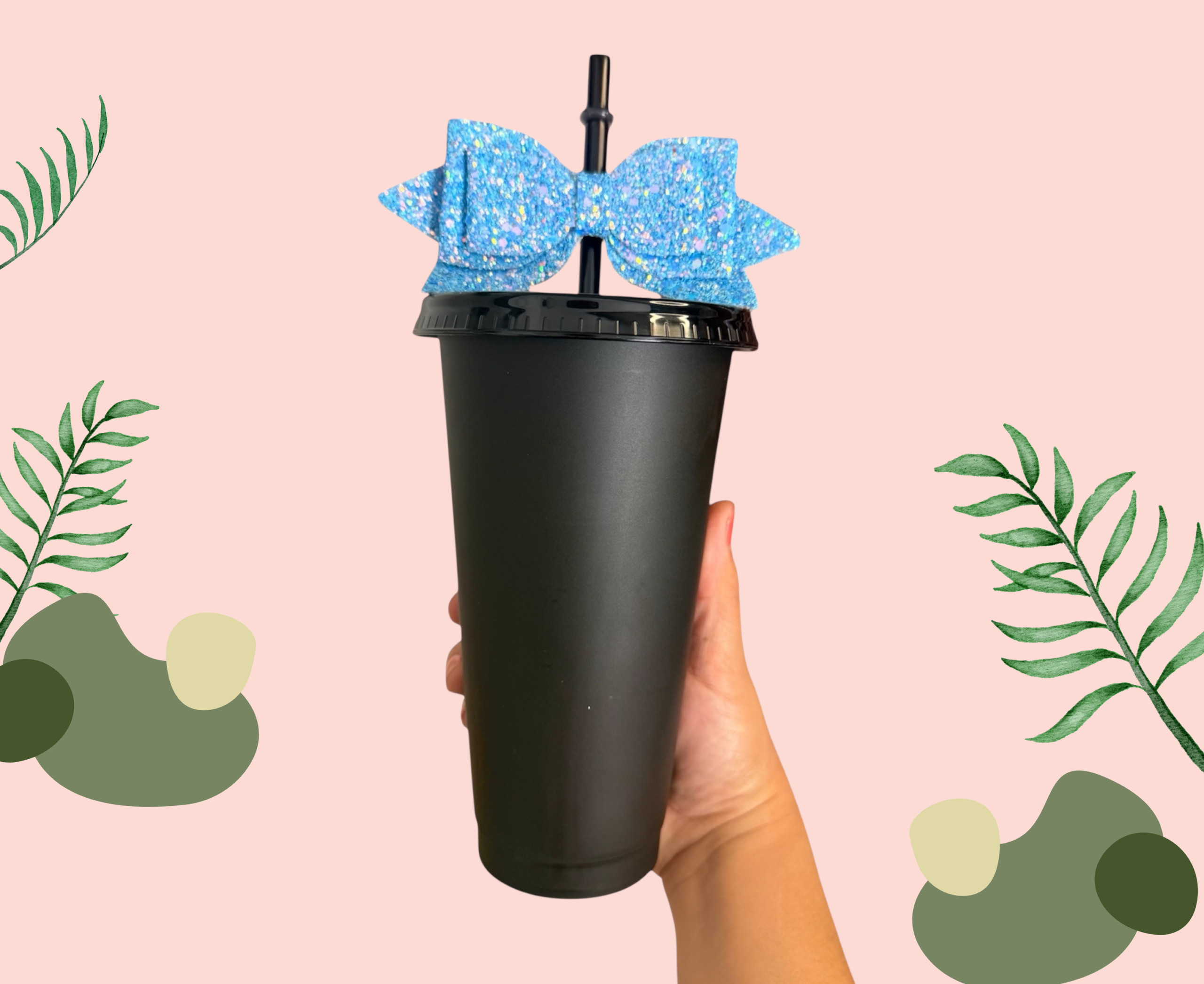 Black plastic cup with a black lid, straw and blue bow