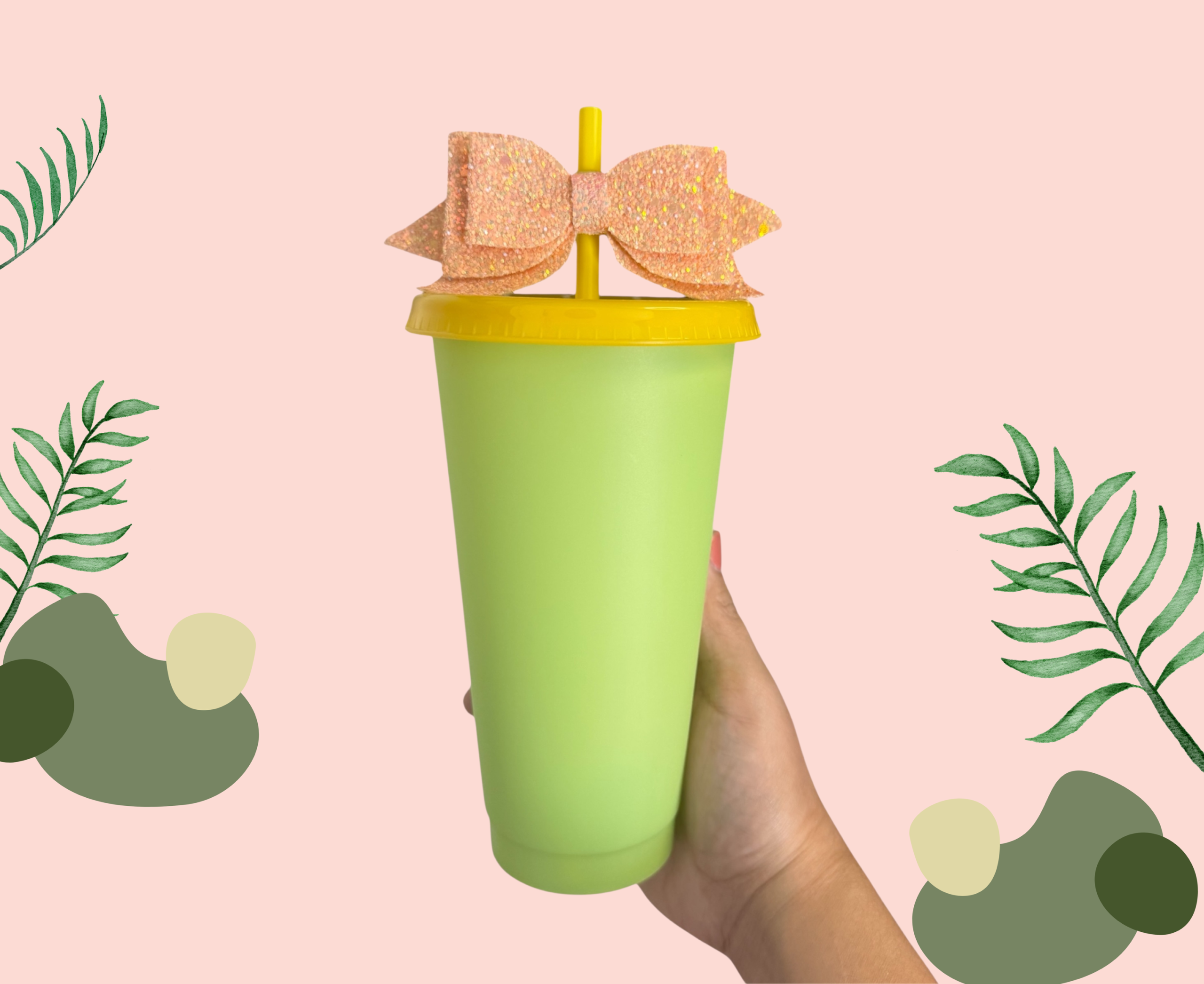 Green plastic cup example with a yellow lid, straw and bow
