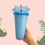 Blue plastic cup with a matching lid, straw and bow