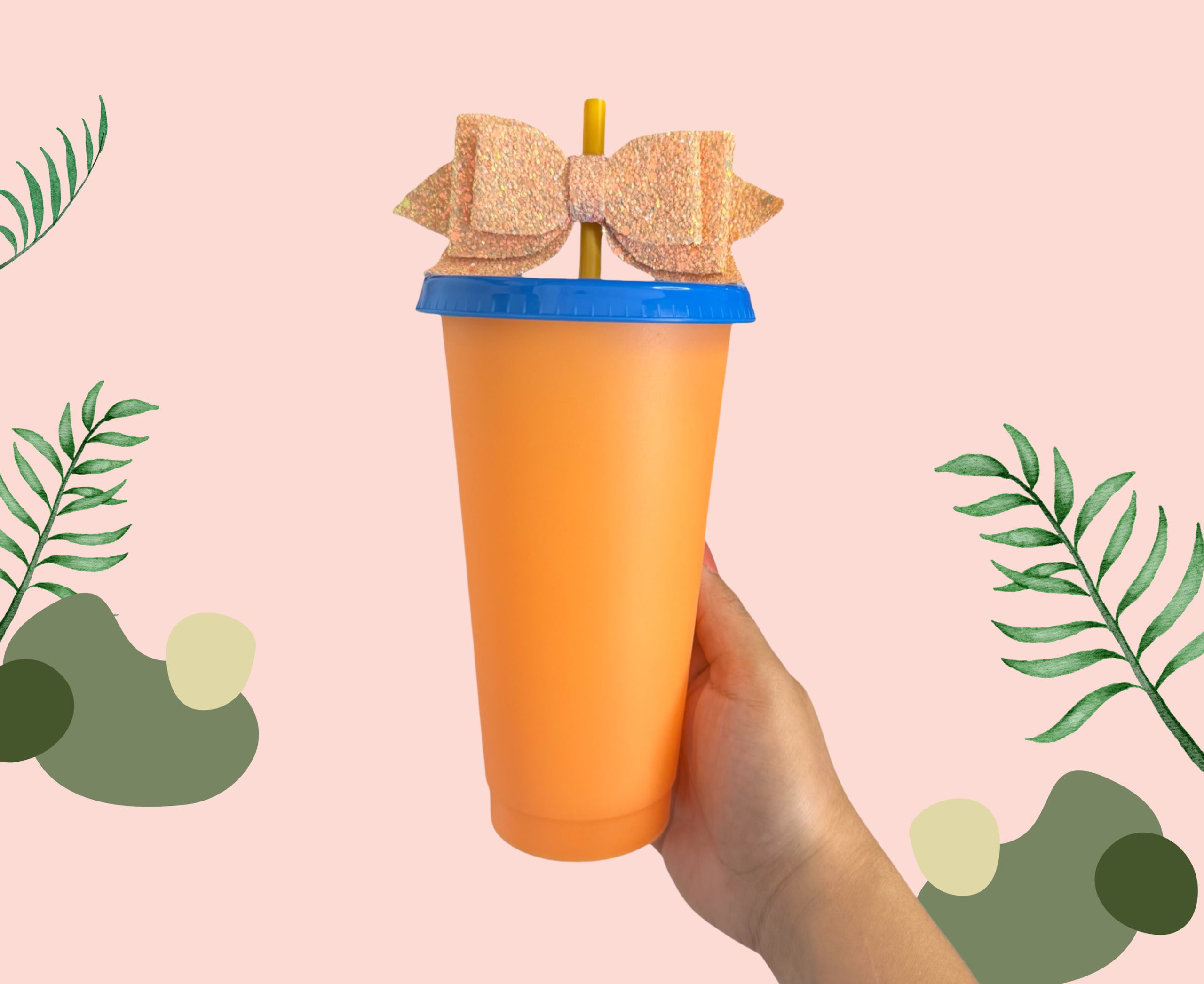 Orange plastic cup with a blue lid, straw and bow