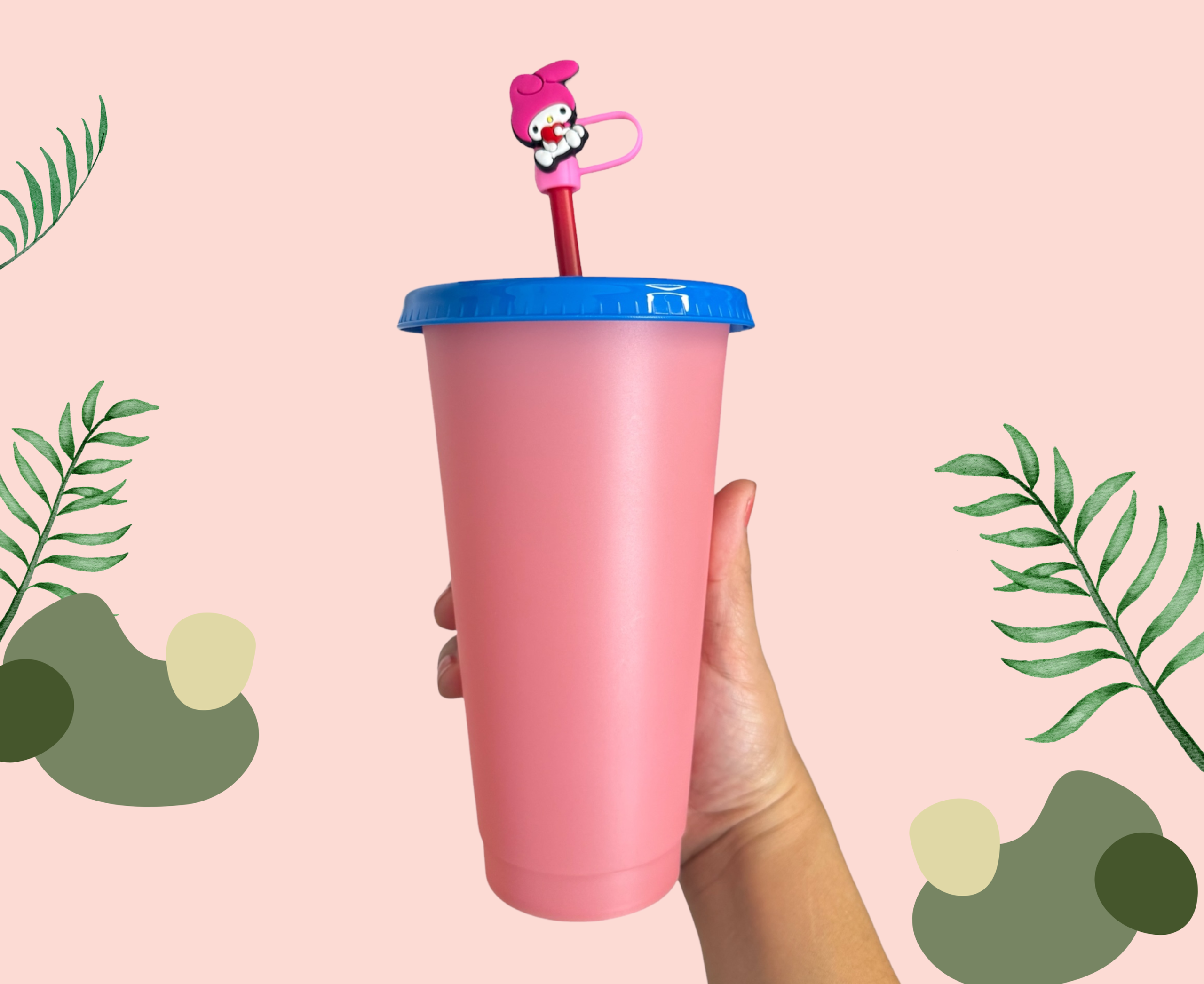 Pink plastic cup with a blue lid and straw